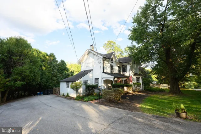 a view of a house next to a yard