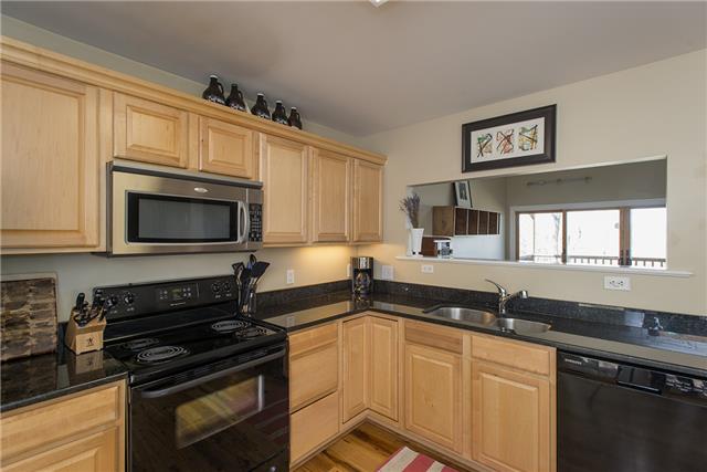 225 Wells Pointe Road Ashland City, TN 37015 - Photo 4 of 20 Granite countertops and stainless/black appliances in this spacious kitchen.