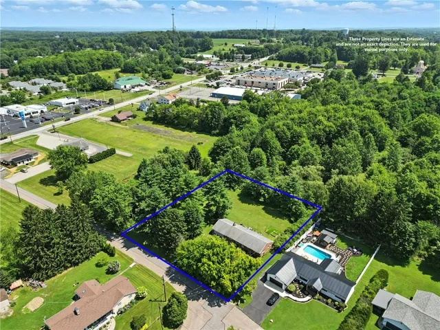 an aerial view of residential houses and outdoor space