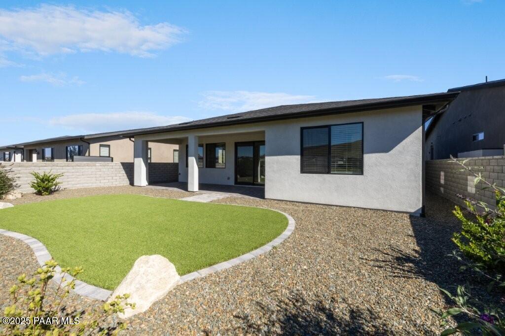 5008 Atwood Court Prescott Valley, AZ 86314 - Photo 27 of 34 a view of a house with a backyard and porch