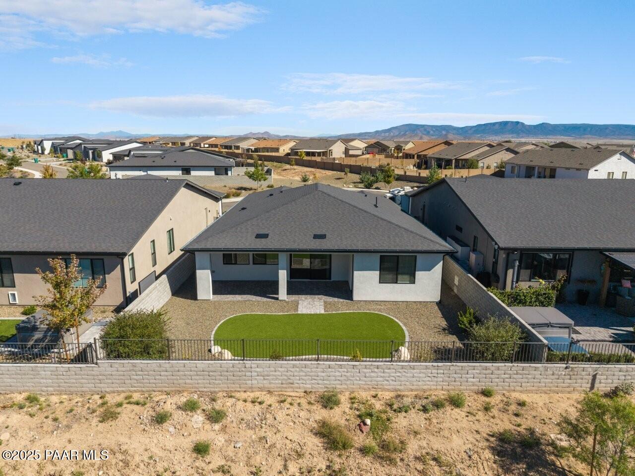 5008 Atwood Court Prescott Valley, AZ 86314 - Photo 31 of 34 a view of a big house with a big yard and large tree
