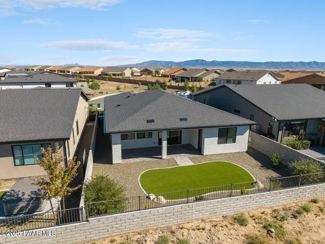 an aerial view of a house with a outdoor space