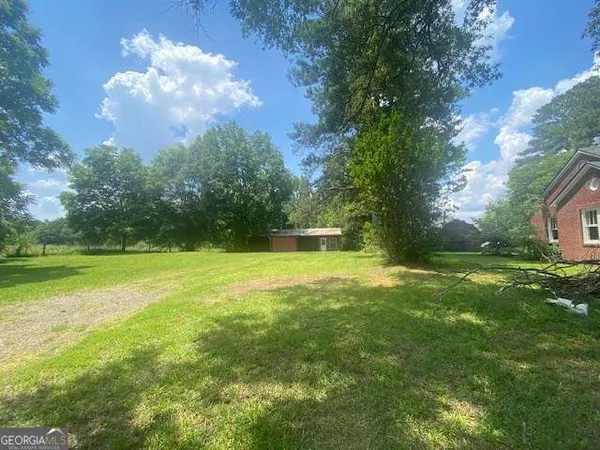 a backyard of a house with lots of green space