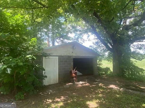 a view of a house with a tree