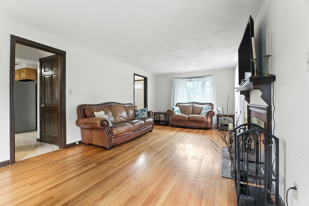 384 Abbott Street Springfield, MA 01118 - Photo 3 of 26 a living room with furniture and a flat screen tv