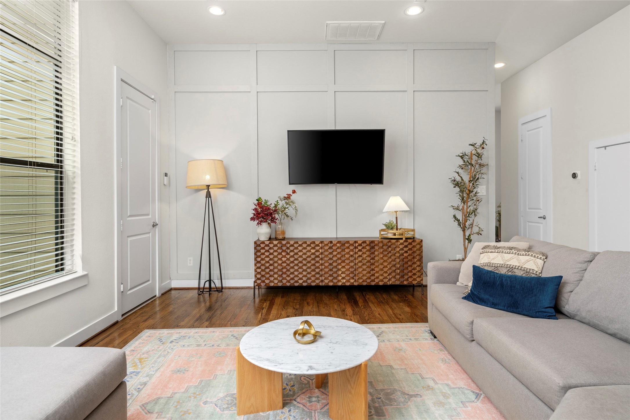 2609 Riverside Drive, Unit E Houston, TX 77004 - Photo 5 of 25 The living room feels especially spacious, with oversized windows bringing in abundant natural light.