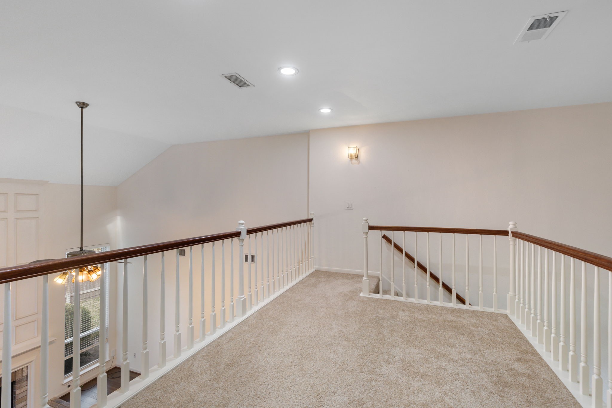 59 Fire Flicker Place Spring, TX 77381 - Photo 23 of 37 This inviting second-floor landing, takes you to the 3 secondary bedrooms, creating a perfect blend of comfort and accessibility.