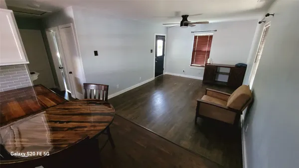 a view of living room with wooden floor