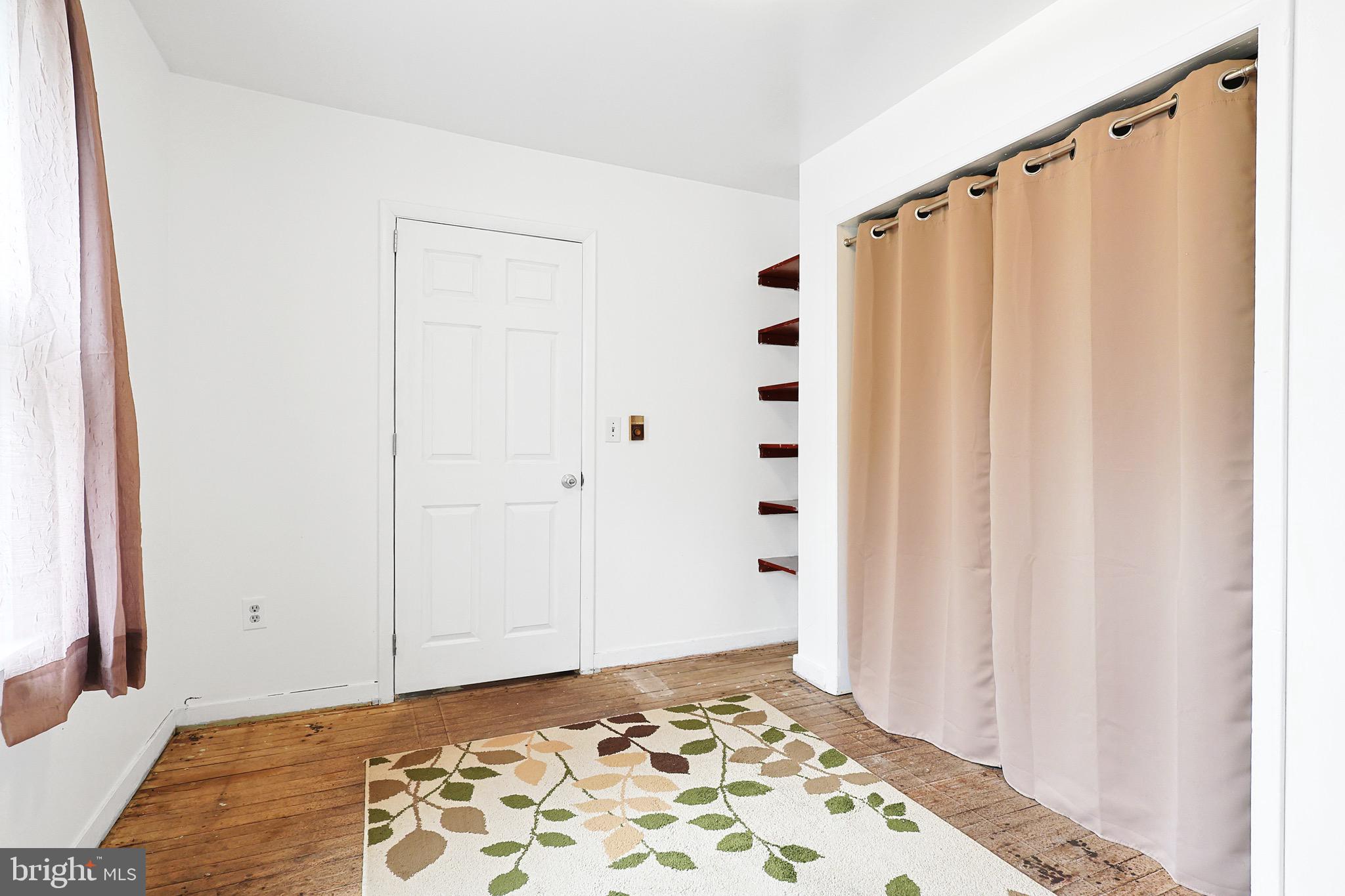 159 Rocket Center Road Keyser, WV 26726 - Photo 29 of 64 a view of a bedroom with wooden floor and a window