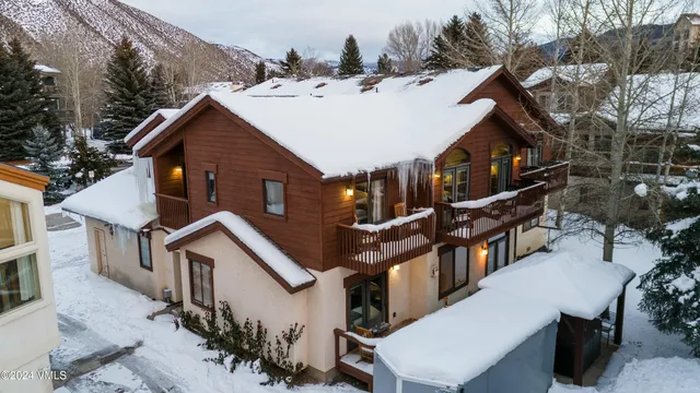 an aerial view of residential houses and outdoor space