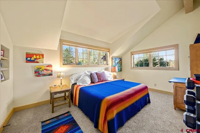 a bedroom with a bed and a table in it