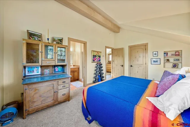 a bedroom with a bed and a cabinets