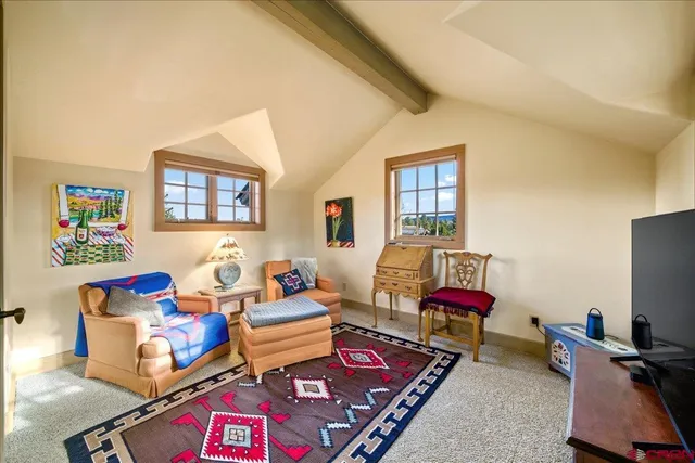 a living room with furniture workspace and a window
