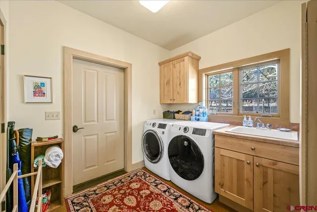 a utility room with dryer and washer