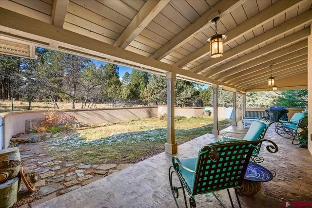 a patio with yard table and chairs