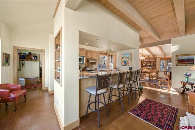 a dining room with wooden floor and breakfast area