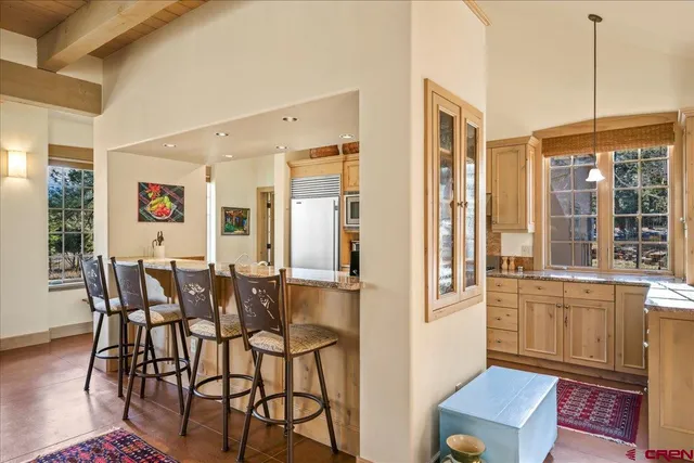 a view of a dining room with furniture window and outside view