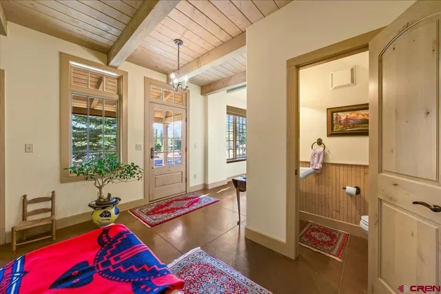 a living room with a bed furniture and a window