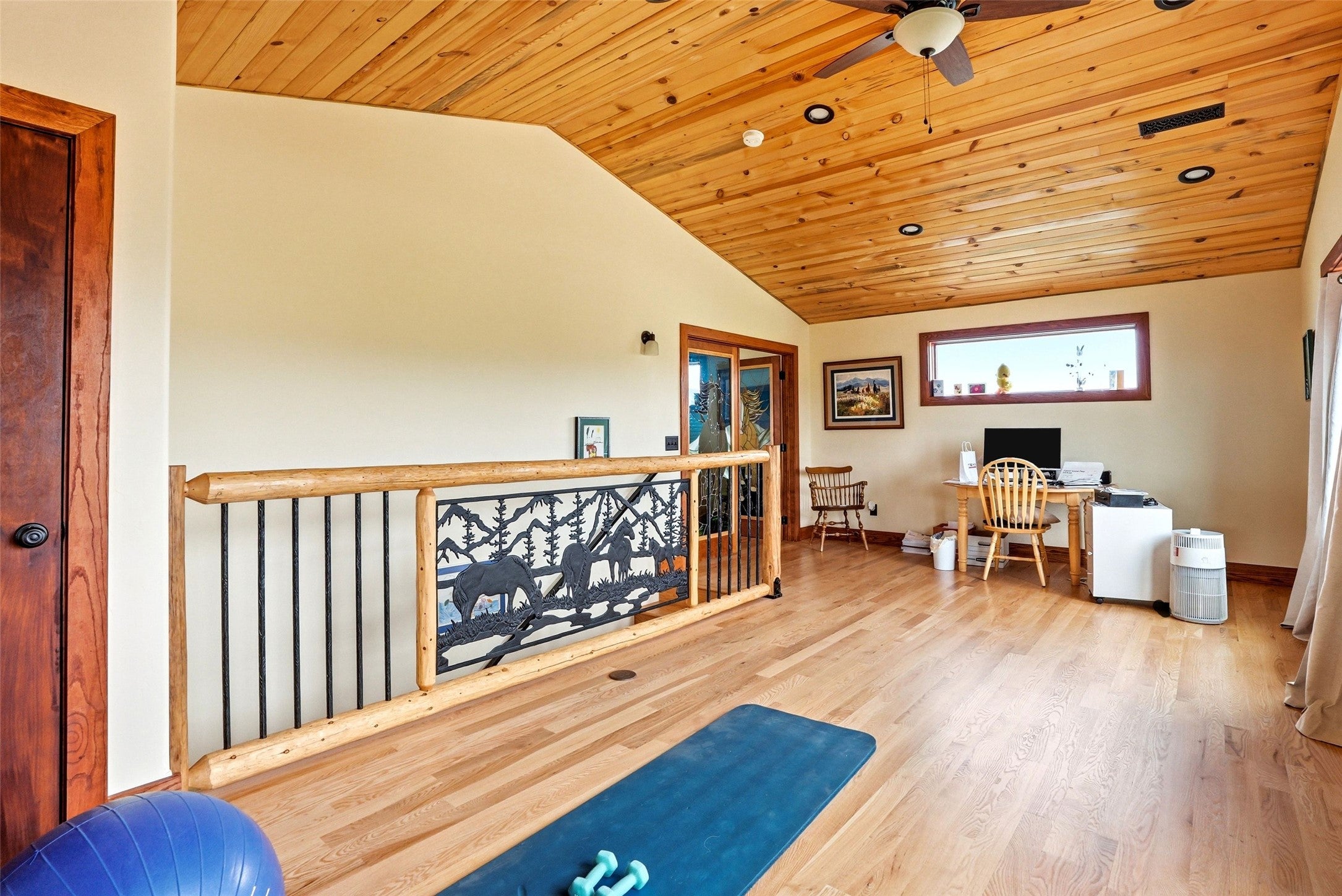 679 Hidden Valley Road North Florence, MT 59833 - Photo 42 of 85 Wood-finish flooring throughout a spacious open area featuring a vaulted wood-paneled ceiling with recessed lighting and a ceiling fan