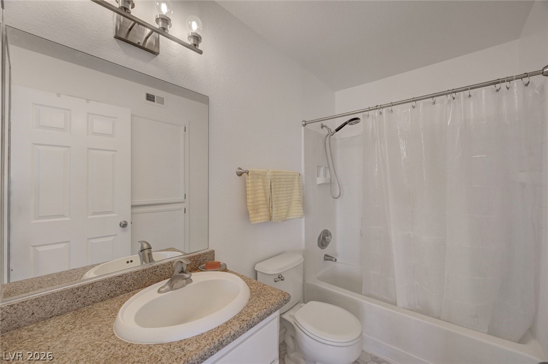 3318 North Decatur Boulevard, Unit 2072 Las Vegas, NV 89130 - Photo 26 of 50 Granite counters and a convenient shower-over-tub design define this well-appointed bathroom.