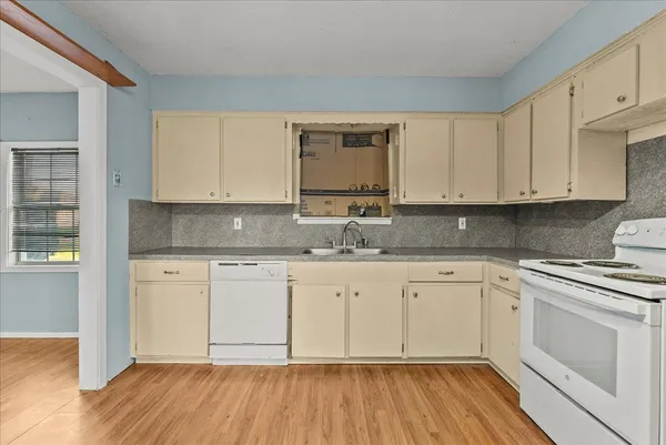 a view of a kitchen with a sink and a kitchen counter space