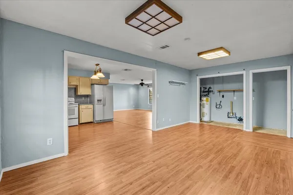 a view of an empty room and wooden floor