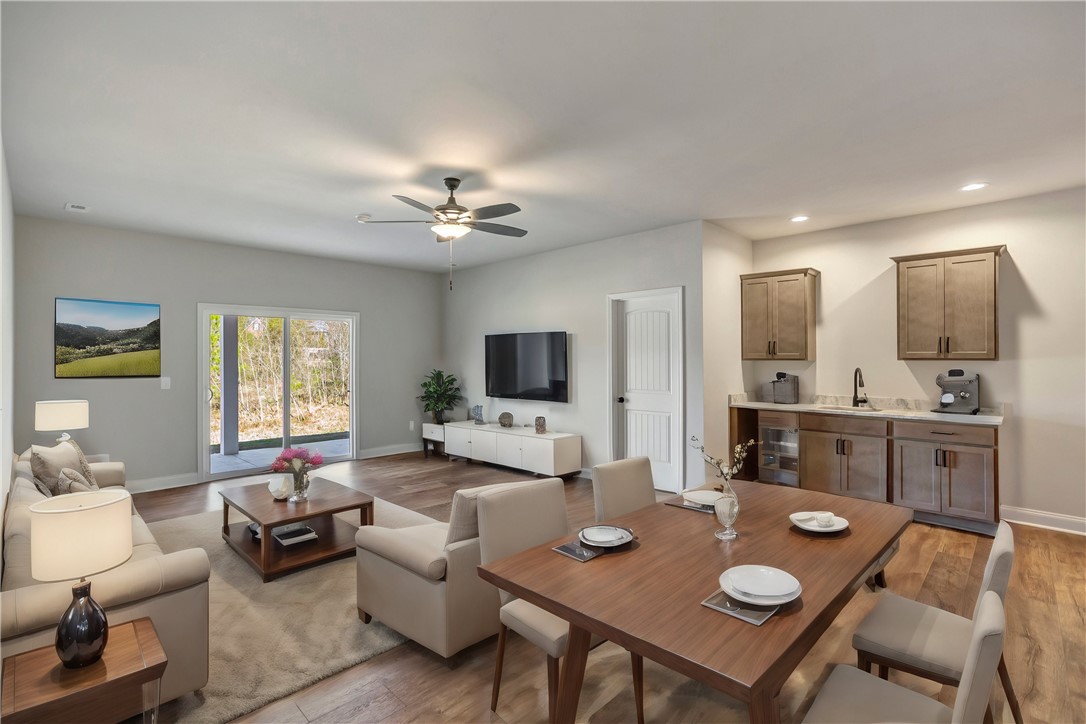 118 Bonaire Point Anderson, SC 29621 - Photo 16 of 23 An inviting open-concept living space features direct outdoor access and a convenient wet bar.