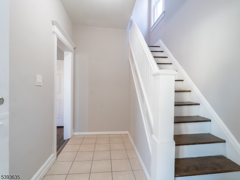 134 Maple Avenue Irvington, NJ 07111 - Photo 12 of 29 a view of an entryway with staircase