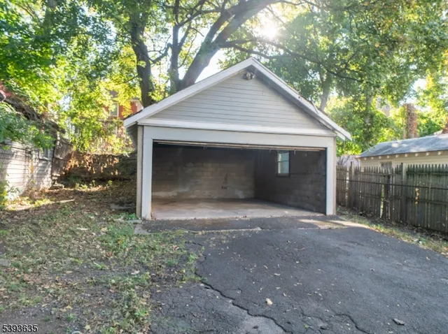 a front view of a house with garage