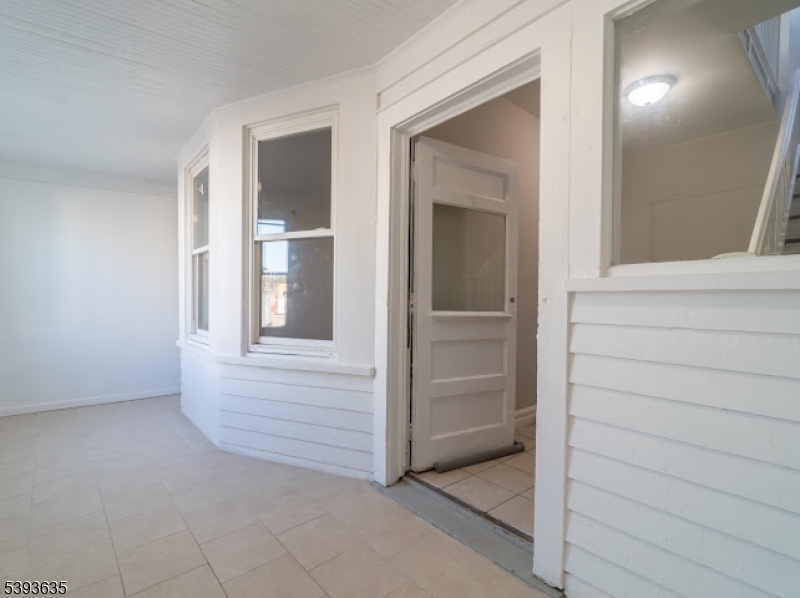 134 Maple Avenue Irvington, NJ 07111 - Photo 3 of 29 wooden floor and window in a room