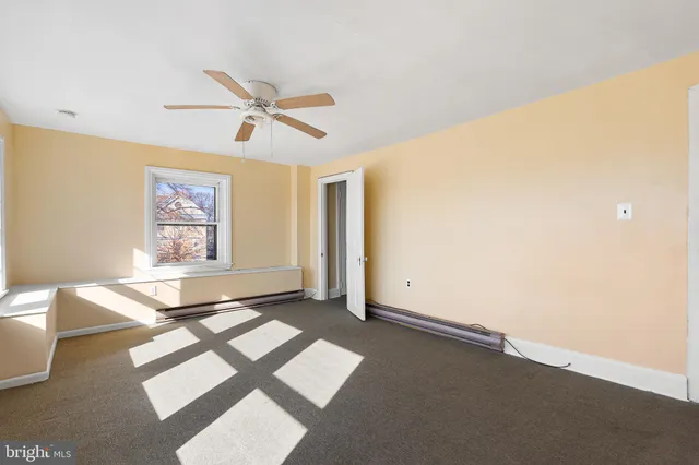 a view of livingroom with hardwood floor and a ceiling fan