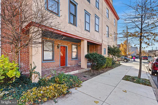 a view of a building with a yard