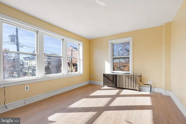 a bedroom with furniture and windows