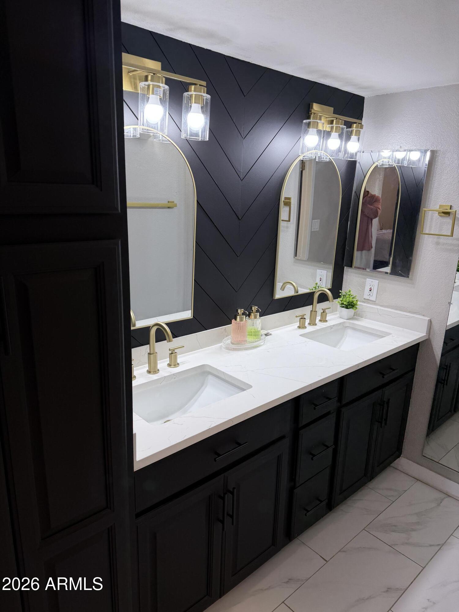 4303 East Cactus Road, Unit 128 Phoenix, AZ 85032 - Photo 29 of 39 a bathroom with a double vanity sink and a mirror