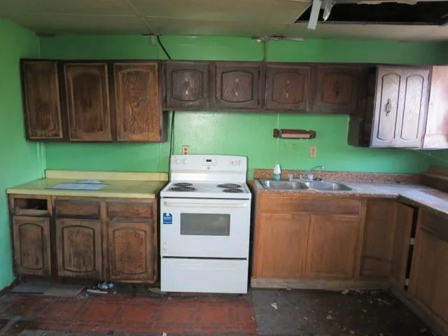 a view of wooden floor and brick walls
