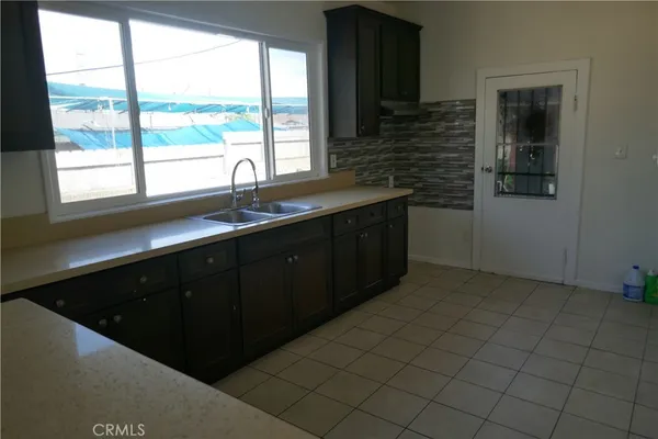 a kitchen with a sink and a window