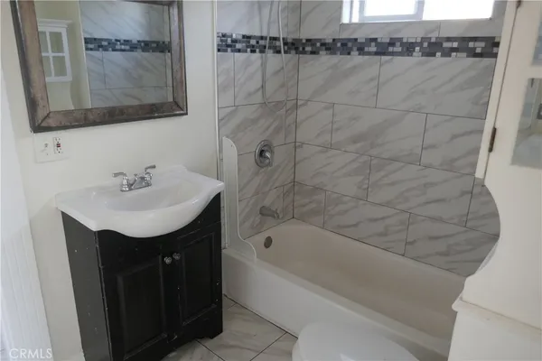 a bathroom with a sink and a bathtub