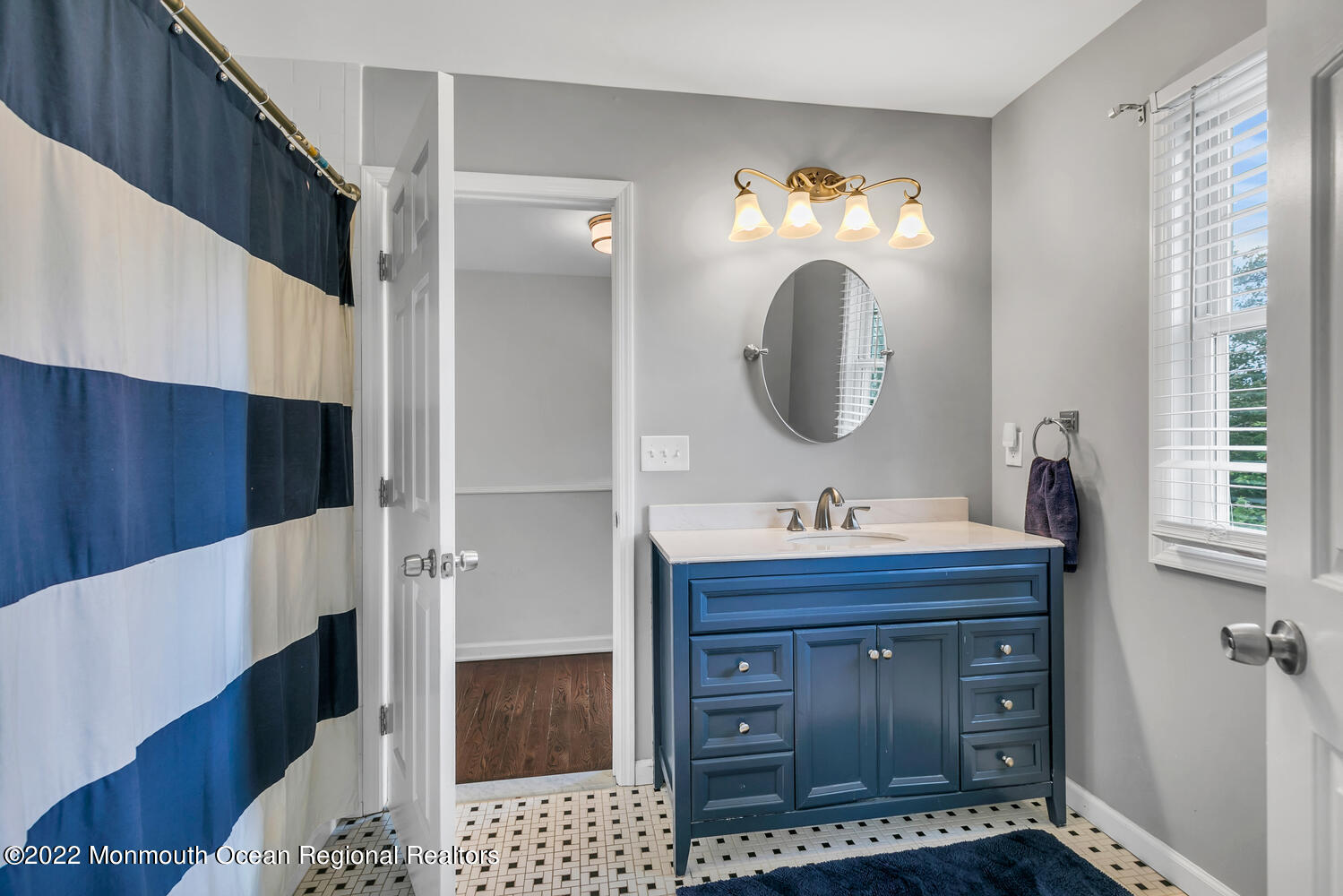814 Pitney Drive Spring Lake Heights, NJ 07762 - Photo 16 of 22 a bathroom with a sink and a mirror