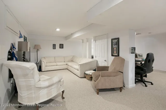 a view of a patio with couches chairs and large windows
