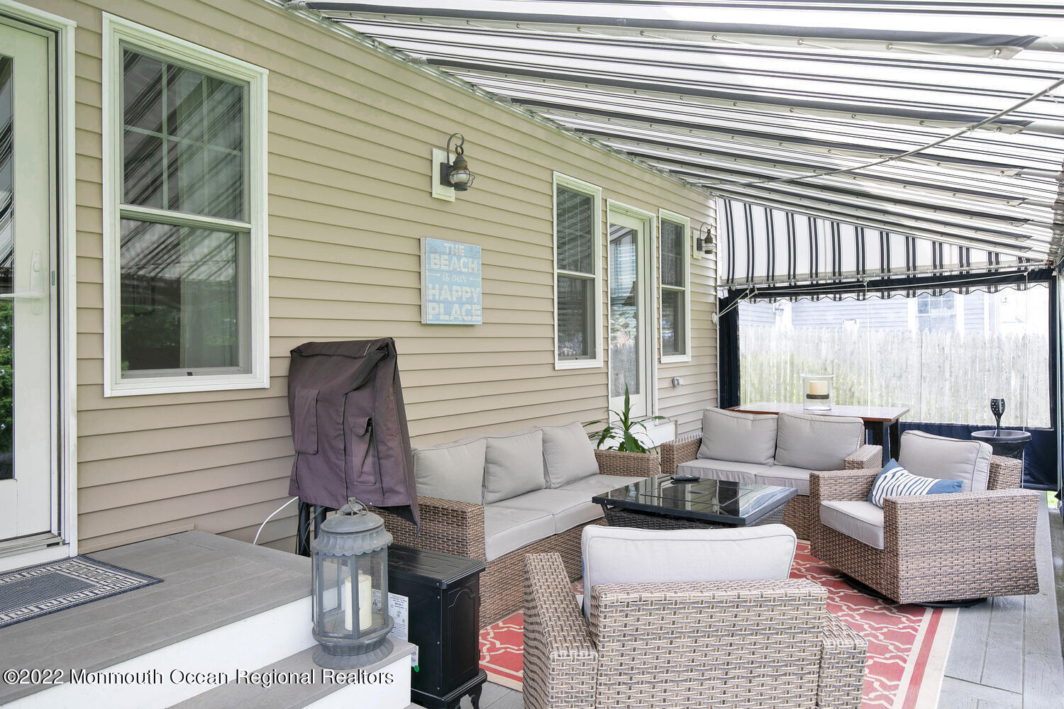 814 Pitney Drive Spring Lake Heights, NJ 07762 - Photo 19 of 22 a view of a patio with couches chairs and large windows