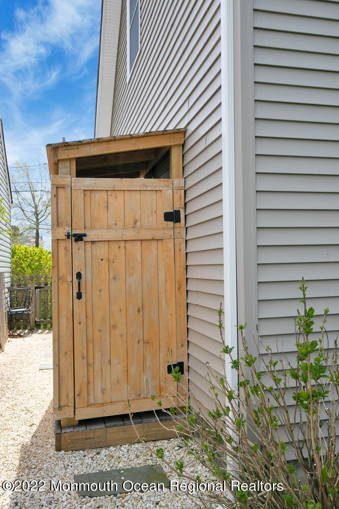 814 Pitney Drive Spring Lake Heights, NJ 07762 - Photo 22 of 22 a view of a house with a door and wooden floor