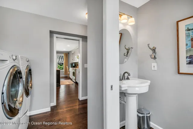 a view of a hallway with washer and dryer