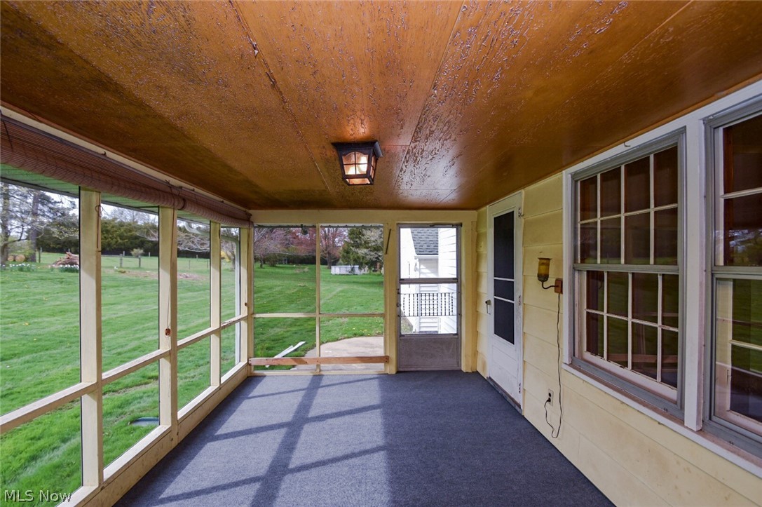 3604 Clark Mill Road Norton, OH 44203 - Photo 14 of 26 Screened in Porch, yes, those are horses in the background