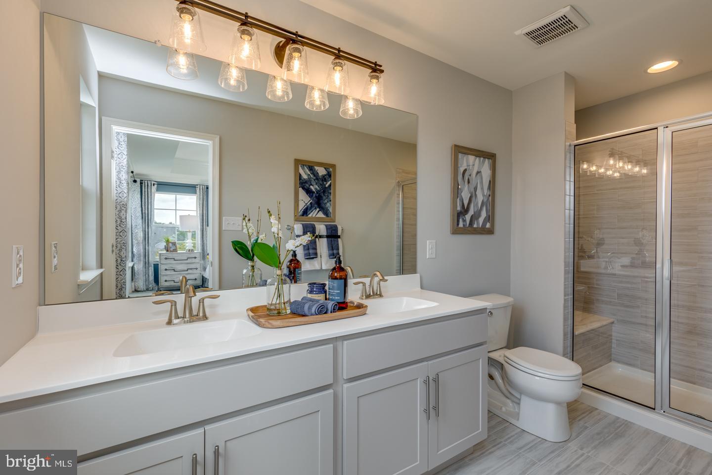 70 Aviary Road West Deptford, NJ 08086 - Photo 13 of 16 a bathroom with a toilet a sink and mirror