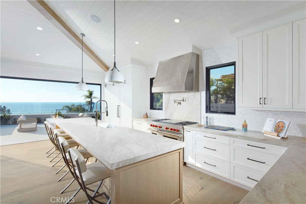 44 Ritz Cove Drive Dana Point, CA 92629 - Photo 16 of 34 a kitchen with a stove a refrigerator and white cabinets