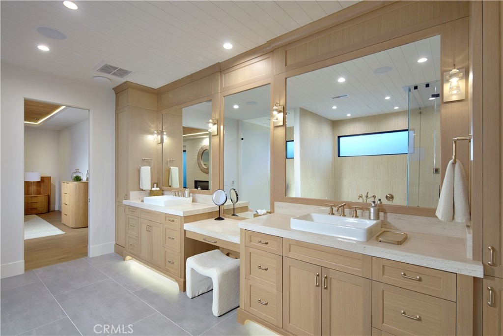 44 Ritz Cove Drive Dana Point, CA 92629 - Photo 24 of 34 a spacious bathroom with a double vanity sink and a mirror