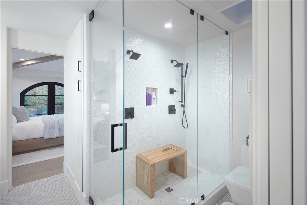 44 Ritz Cove Drive Dana Point, CA 92629 - Photo 29 of 34 a bathroom with a shower sink and mirror