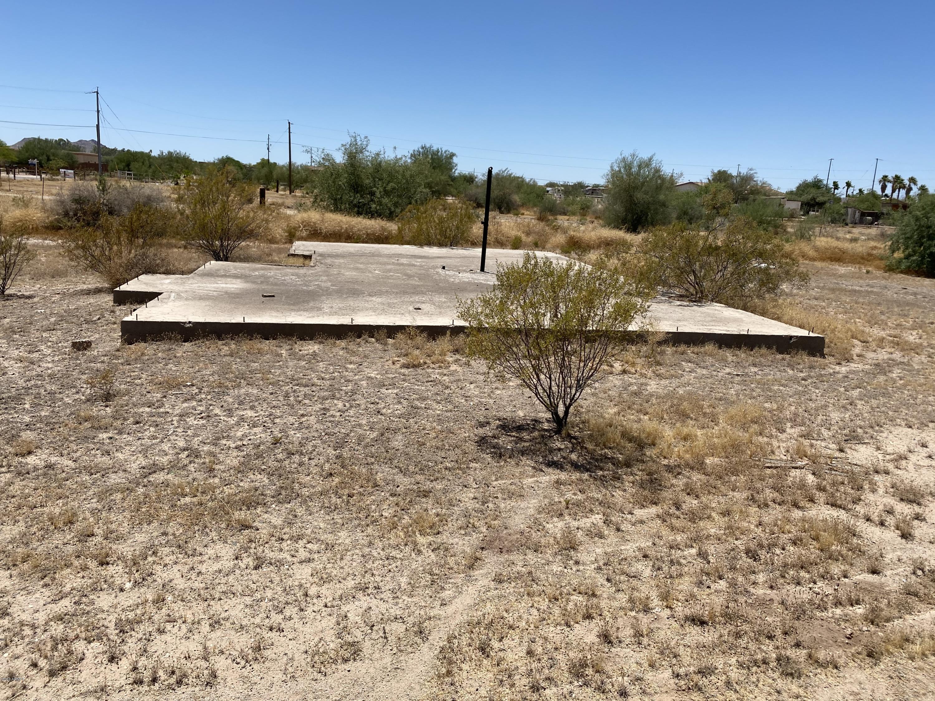 20616 West Telegram Path Road Buckeye, AZ 85326 - Photo 5 of 8 a view of a dry yard with trees