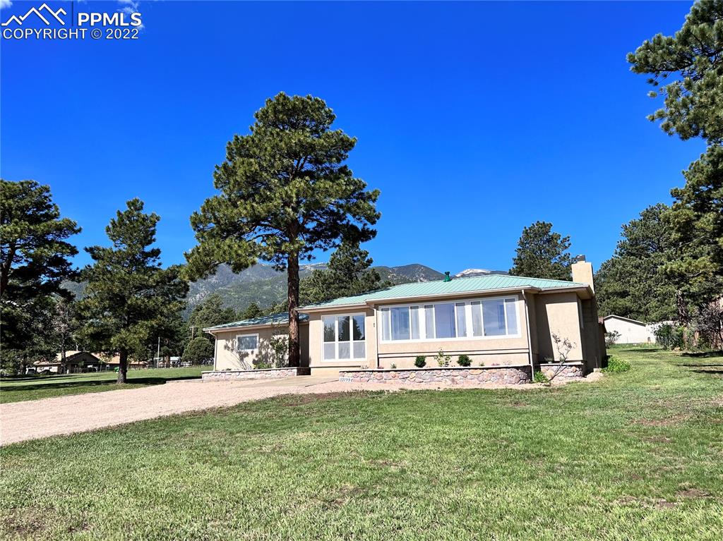 10199 Singer Lane Rye, CO 81069 - Photo 4 of 39 a front view of a house with garden