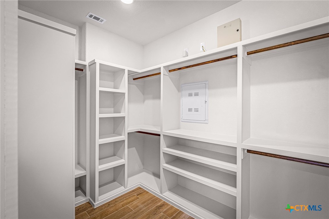 319 Serenity Pass Spring Branch, TX 78070 - Photo 17 of 26 a view of walk in closet with empty racks